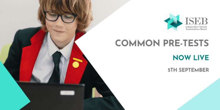 A boy in uniform wearing glasses smiles as he works on a computer. Text: ISEB Common Pre-Tests Now Live 5th September