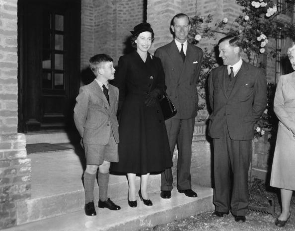 Prince Charles arrives at Cheam School in Berkshire to start his first term, and is introduced to the headmaster, Peter Beck, 23rd September 1957. The Queen and Duke of Edinburgh accompany him. (Photo by Reg Birkett/Keystone/Getty Images